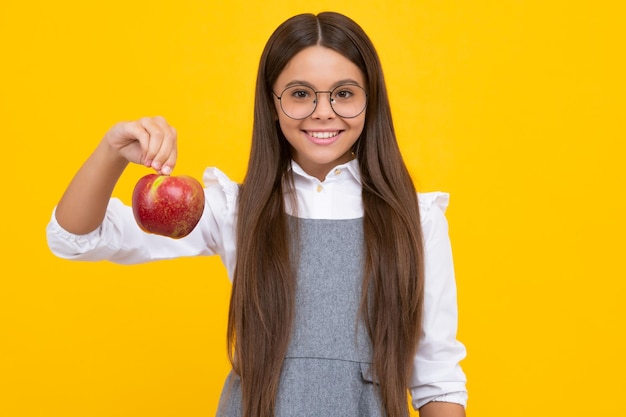 Spring everywhere spring season fruits full of vitamins organic food only natural and healthy happy childhood kid eat apple child with fruit Happy girl face positive and smiling emotions