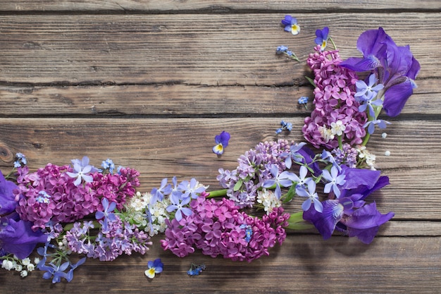 Spring flowers  on old wooden background