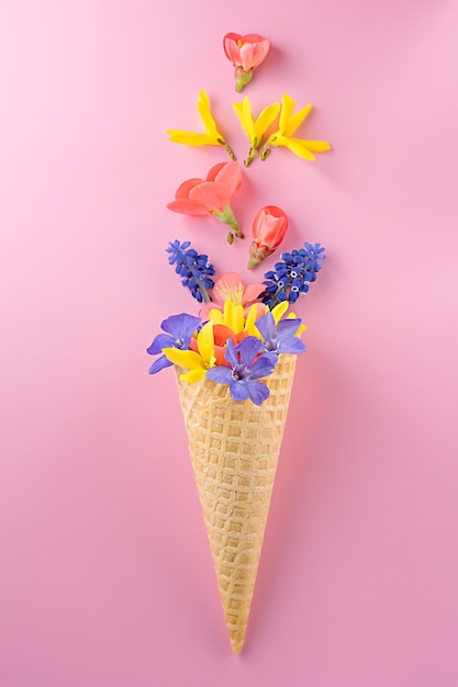 spring flowers in waffle cone bouquet flat lay