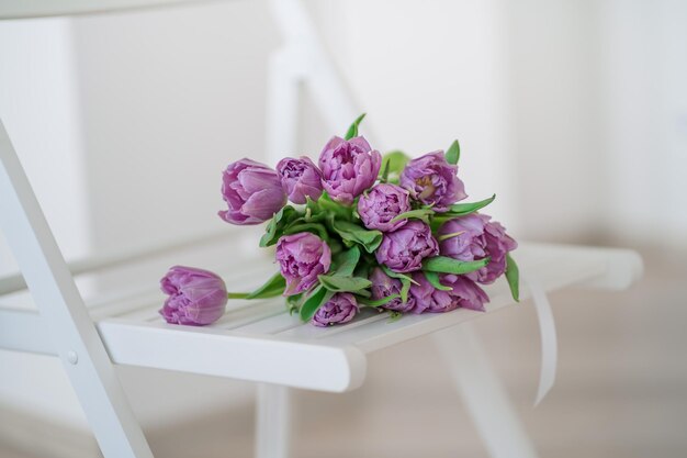 Spring flowers on a white chair