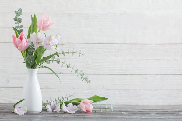 Spring flowers in white vase