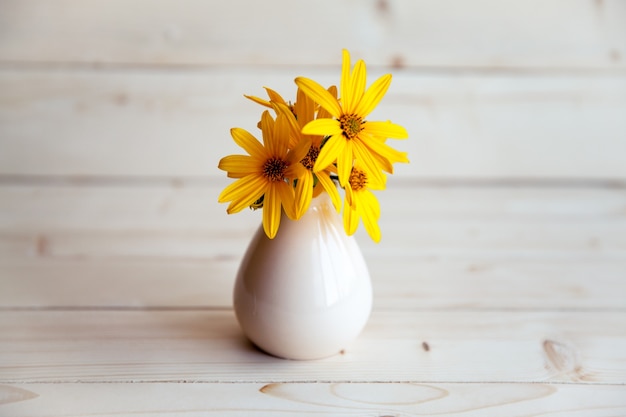 Spring flowers in white vase