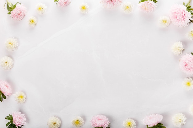 Spring frame of small flowers and daisy floral arrangement