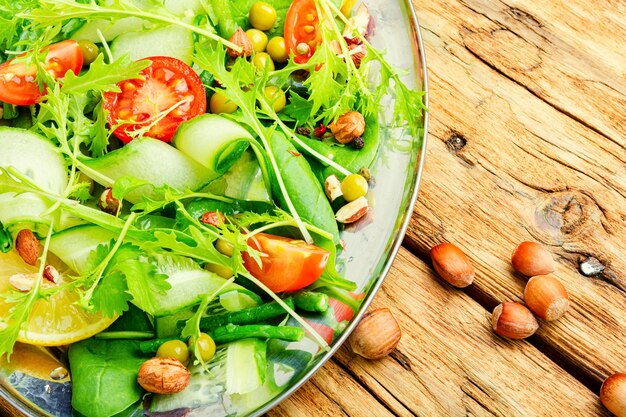 Spring green salad with vegetables and nuts.Diet menu