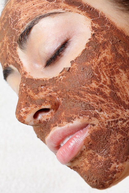Spring, health, people, youth and beauty concept -Natural homemade fruit facial masks. Fresh fruit. Spa Woman applying Facial cleansing Mask. Beauty Treatments