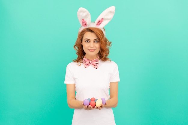 Spring holiday smiling girl in bow tie bunny hunt begin just having fun ready for party cheerful bunny lady with painted eggs egg hunt happy easter holiday funny woman in rabbit ears