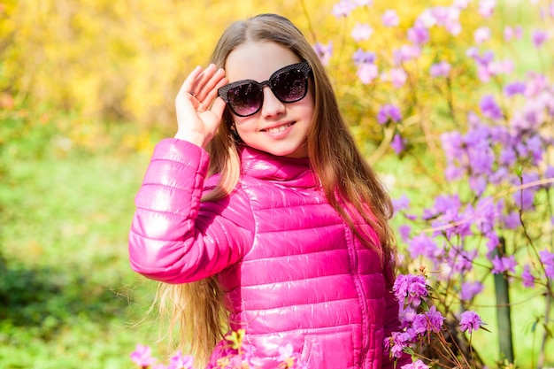 Spring holiday Womens day happy child with cherry bloom summer nature Sakura Natural beauty Childhood happiness little girl smell blooming flowers Complete relax