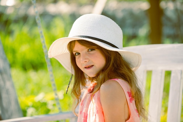 Spring kids girl outdoor child cute face happy child relax in spring background