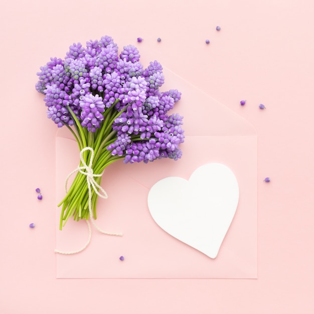 Spring lilac flowers and a heart shape card