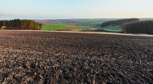 Spring morning arable and growth fields and countryside