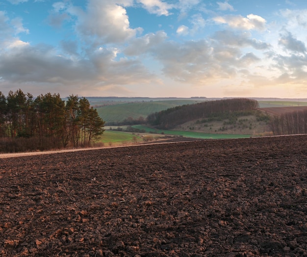 Spring morning arable and growth fields and countryside