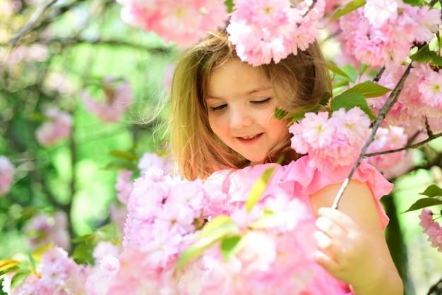 Spring in my head Little girl in sunny spring Summer girl fashion Happy childhood Springtime weather forecast face and skincare allergy to flowers Small child Natural beauty Childrens day