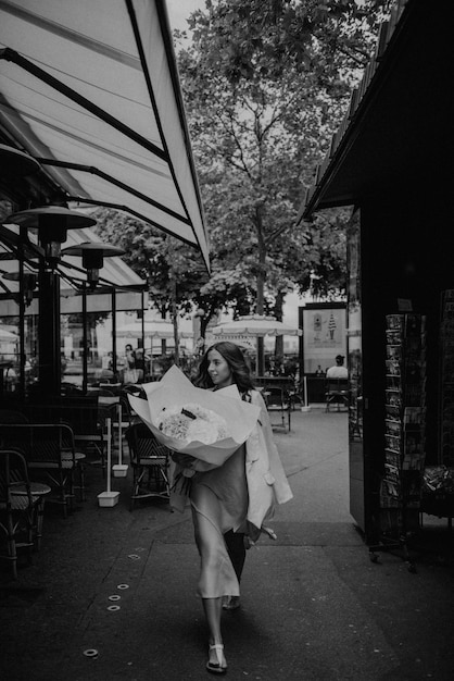 Spring in Paris looks amazing Woman in pink dress in Paris