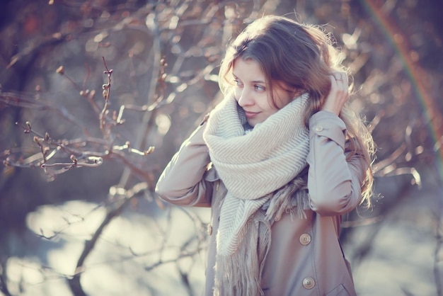 spring photo beautiful girl in a coat in the city