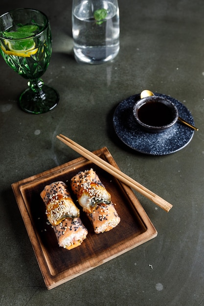 Spring rolls with salmon, shrimp and eel