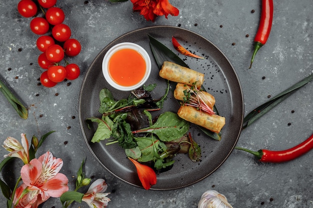 Spring rolls with shrimp with sweet chili sauce asian cuisine