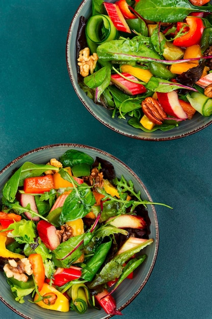 Spring salad with rhubarb greens and nuts