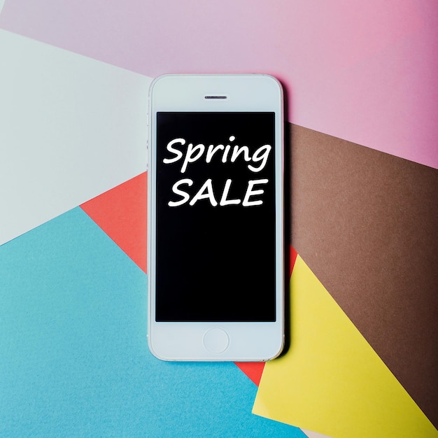 Spring sale inscription on the smartphone display