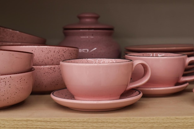 Photo spring shopping pink dishes on a supermarket shelf closeup