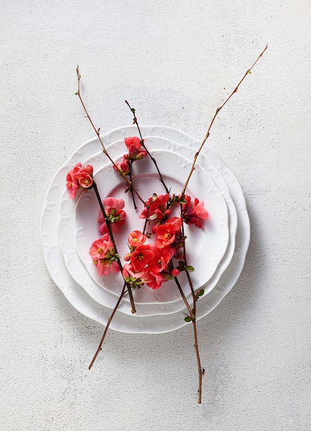 Spring table setting with flowering branches.