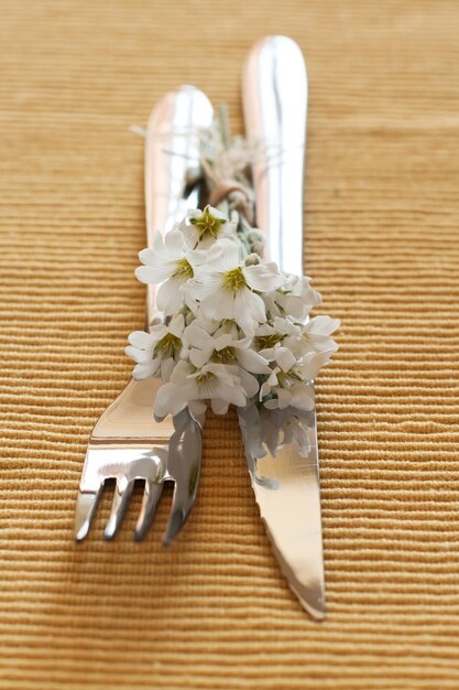 Spring table setting with white flowers copy space