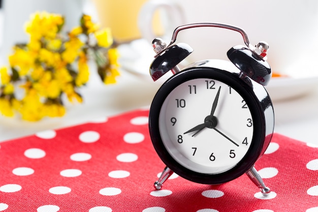 Spring Time Change  with alarm clock and flower branches