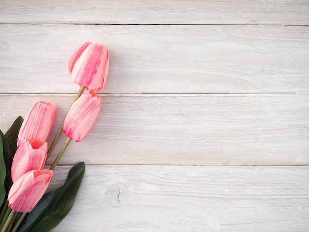 Spring tulips flowers on a old wooden