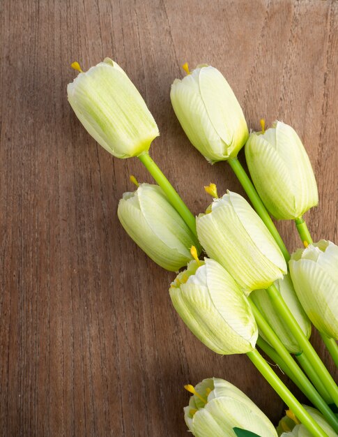 Spring tulips flowers on a old wooden