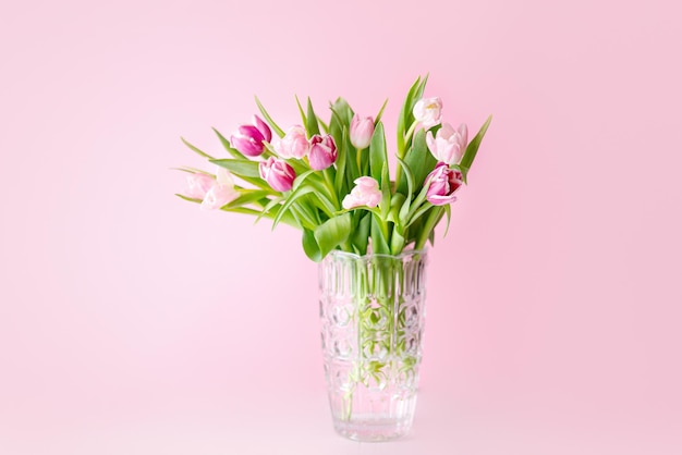 Spring tulips on pink background Greeting card for mothers day