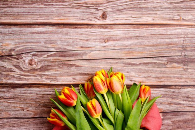 Spring tulips on wooden background