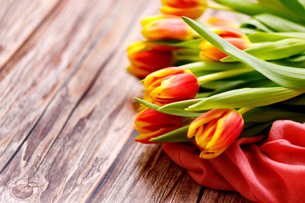 Spring tulips on wooden background