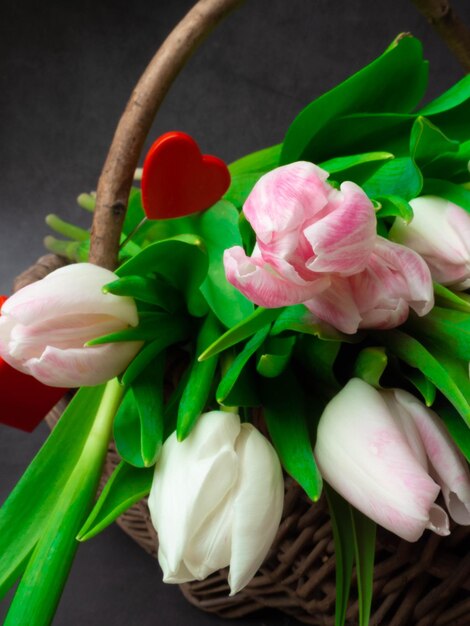 Spring tulips in wooden basket happy mothers day romantic still life fresh flowers