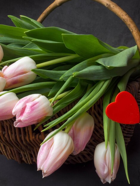 Spring tulips in wooden basket happy mothers day romantic still life fresh flowers