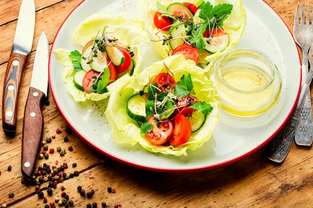 Spring vegetable salad on wooden table,summer food