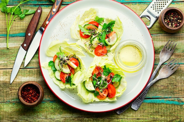 Spring vegetable salad on wooden table