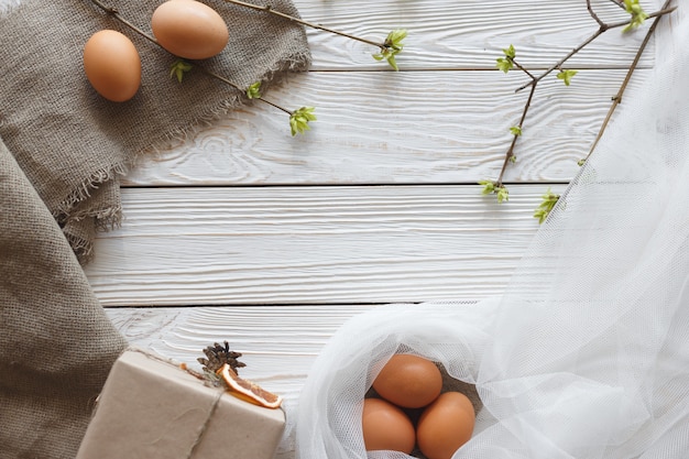 Springtime Easter composition on a white wooden background