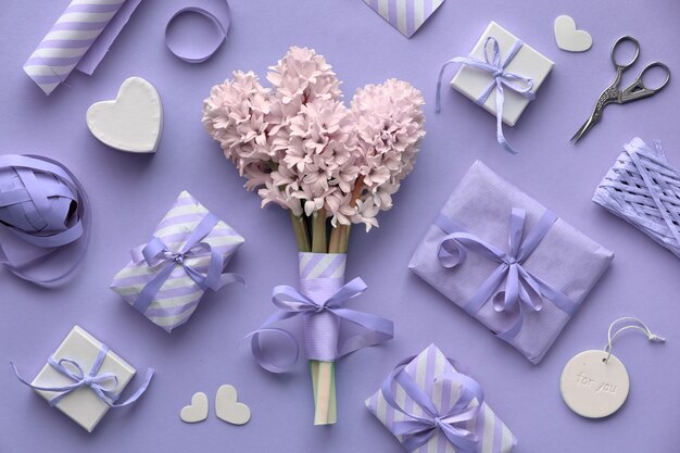 Springtime lilac colored with pink hyacinth, wrapped gift boxes and decorations