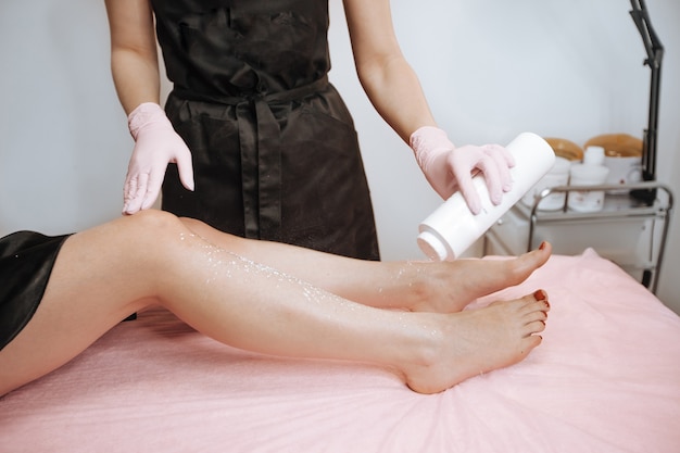 Sprinkle powder on your feet before sugaring