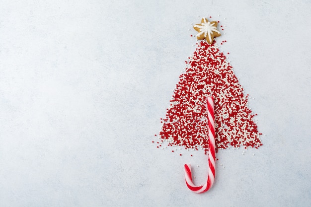 Sprinkles and lollipop in a Christmas tree shape