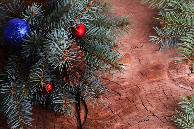 Spruce branches on a wooden background