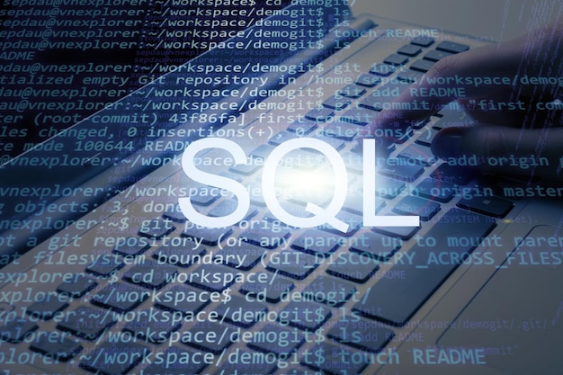 Sql inscription text against laptop and code background. learn
sql programming language,