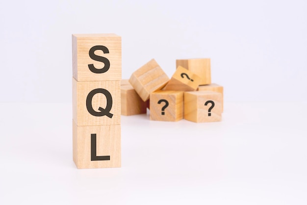 SQL text Structured Query Language on wooden cubes language concept