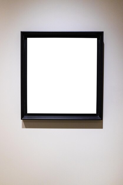 Square black picture frame on gray vertical wall