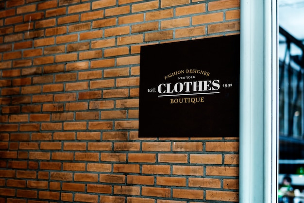 Square black sign on a brick wall mockup