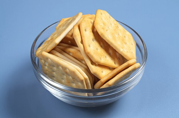 Square crackers in bowl on the table