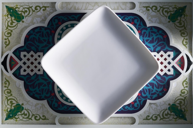 Square empty saucer on islam deign element tray