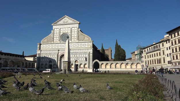 The square and facade of Santa Maria Novella in Florence Italy