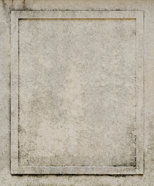 Foto forma quadrata della cornice scolpita su un vecchio muro di pietra