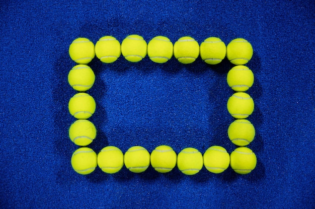 Square of padel balls on the court