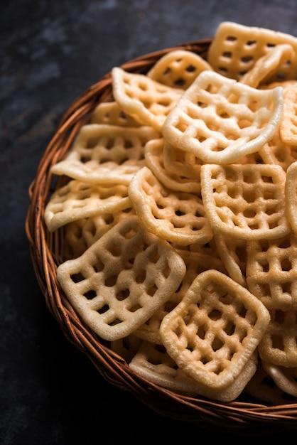 Square shape checkered Fryums Papad is a crunchy Snack Pellets served in a bowl